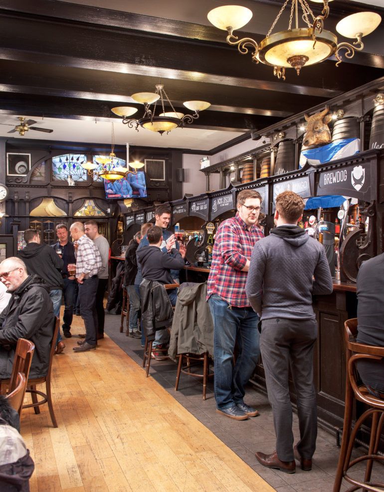 People and students drinking in Paisley pub, The Bull