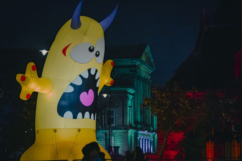 An inflatable monster next to Paisley Town Hall at Paisley Halloween Festival 2023.
