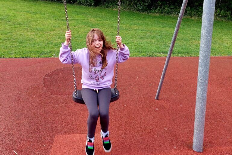 Hannah on the swing in Bridge of Weir play park