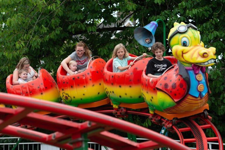 Kids on funfair ride at Barshaw Gala Day 2023